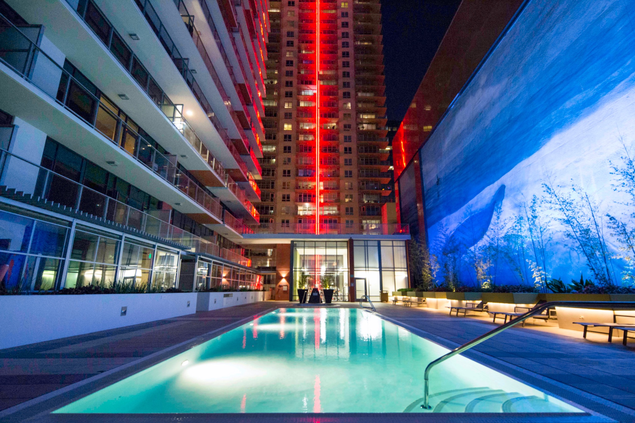 High-rise commercial pool with ambient lighting at night