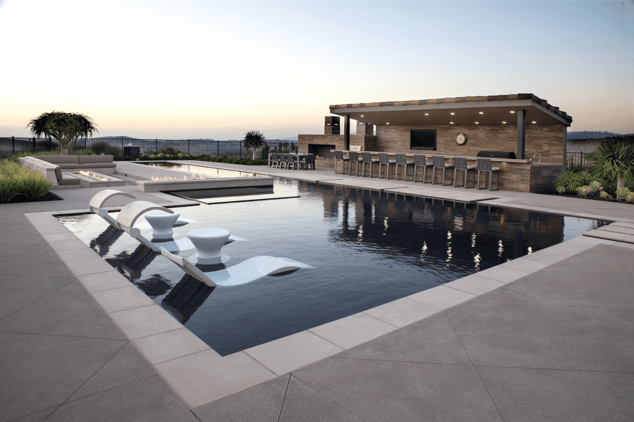 A wide shot of a luxury pool in the daytime