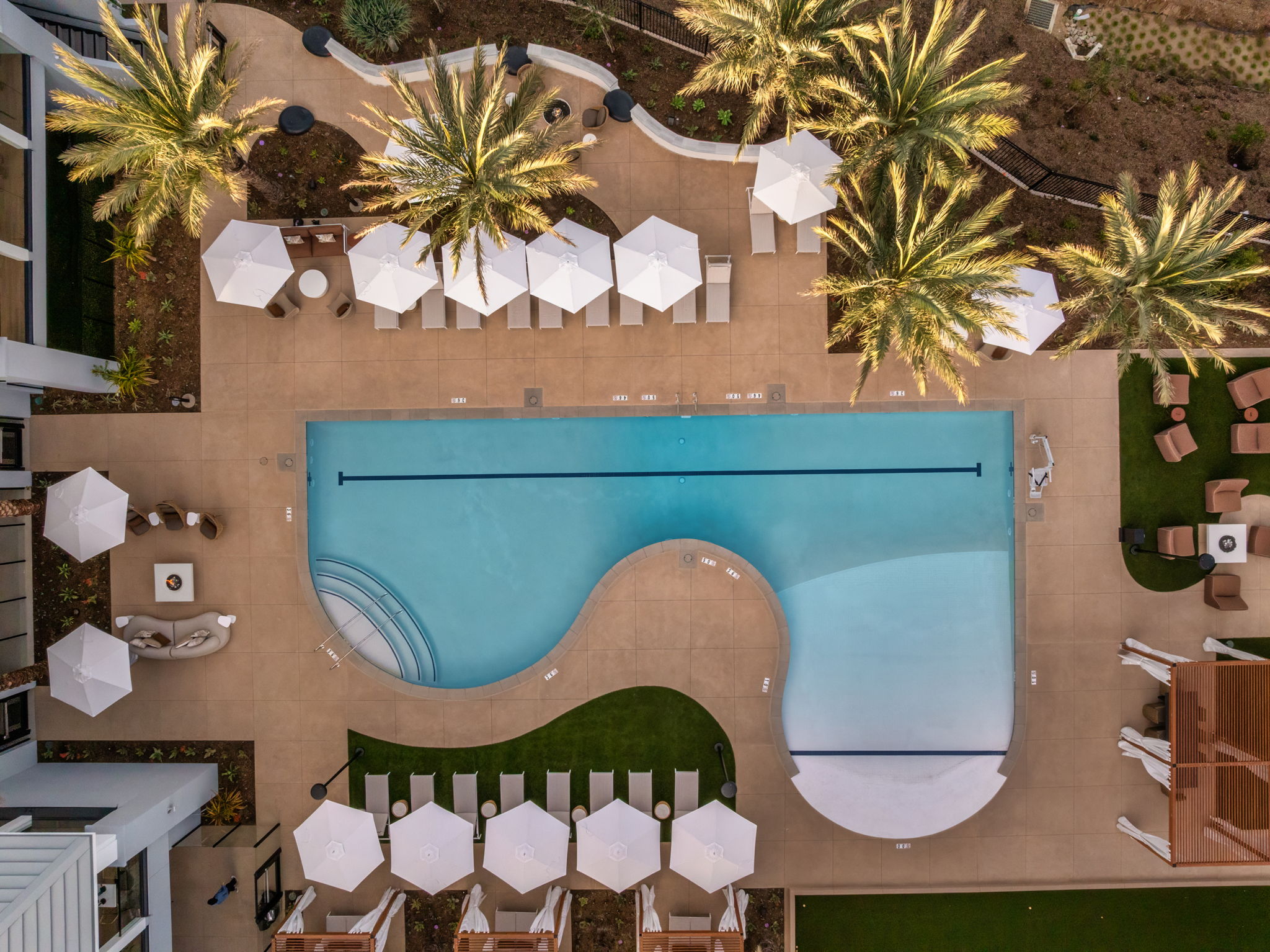 Aerial view of resort-style commercial pool with lounge deck