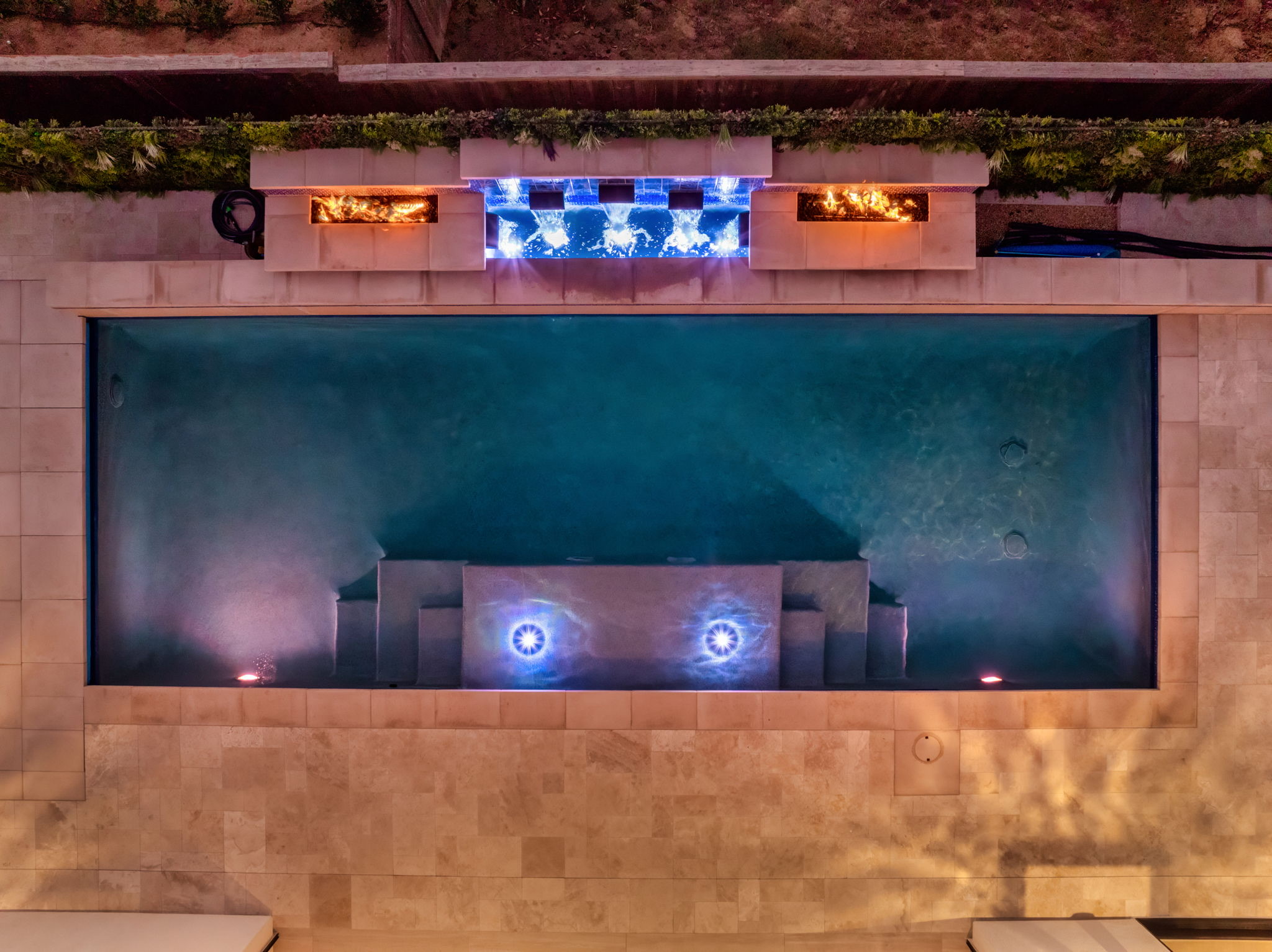 Luxury pool renovation with LED lighting and fire and water features
