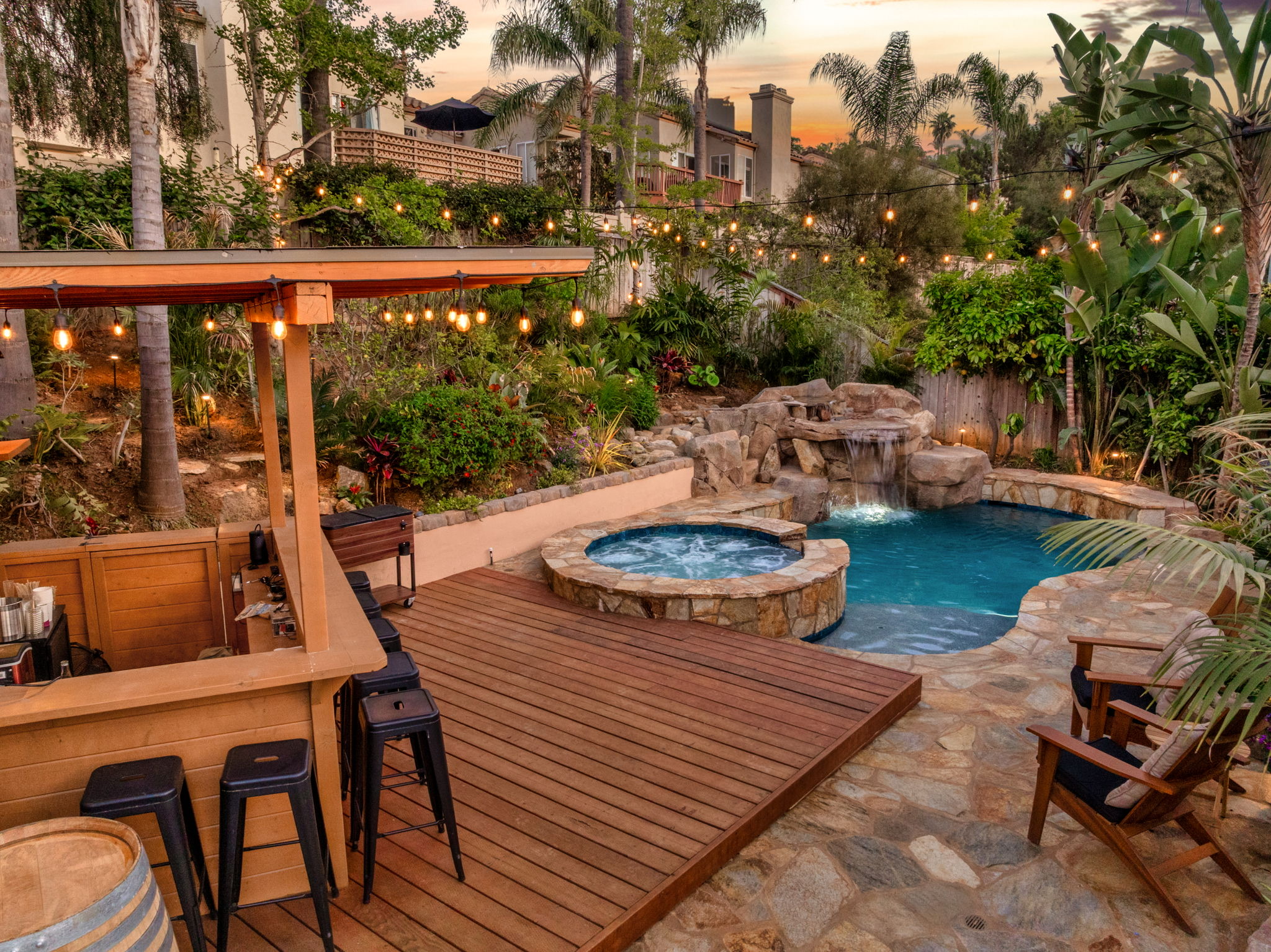 Pool deck with proper drainage and non-slip surfaces around spa area